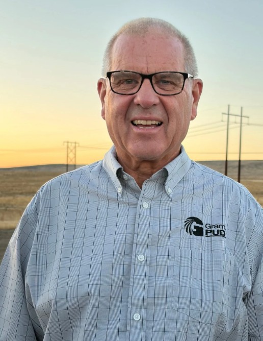 Larry Schaapman at sunset near power lines in Grant County